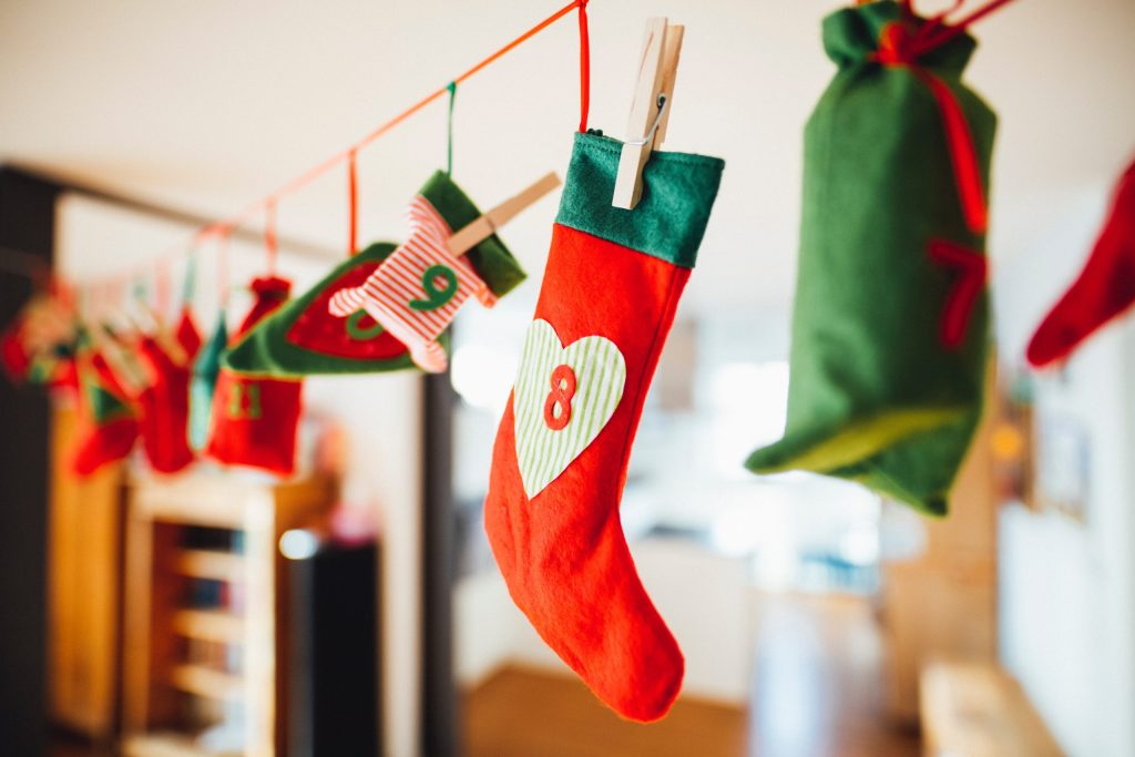 Christmas stockings and an advent calendar hanging in a home